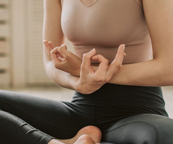 Close-up of athletic shoes on a yoga mat.